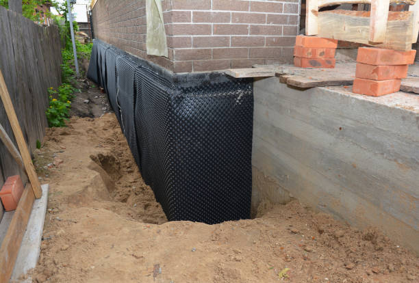 Happy homeowners after waterproofing job in Sterrett